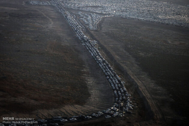 pilgrims' cars parked near border crossing