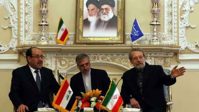 Ali Larijani at a meeting with Nouri al-Maliki