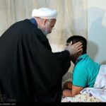 President Rouhani visits disabled war veteran (PHOTOS)
