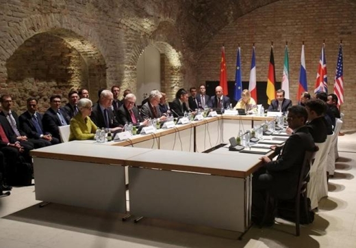 Negotiators of Iran and six world powers face each other at a table in the historic basement of Palais Coburg hotel in Vienna