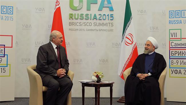 Iranian President Hassan Rouhani (R) meets with his Belarusian counterpart Alexander Lukashenko on the sidelines of the 7th BRICS summit in Ufa, Russia, on July 9, 2015. 