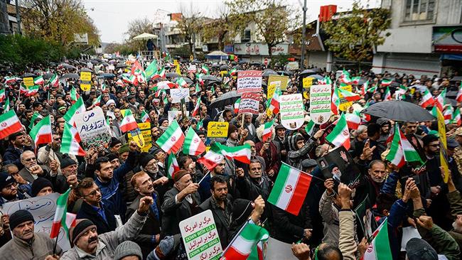 Iranian People Pour into Streets to Back Islamic Establishment