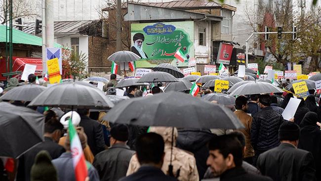 Iranian People Pour into Streets to Back Islamic Establishment