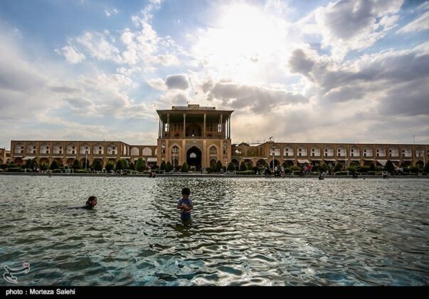 Children Using Naqsh-e Jahan Square as Swimming Pool in Hot Summer