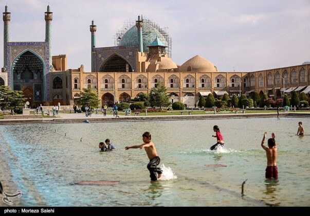 Children Using Naqsh-e Jahan Square as Swimming Pool in Hot Summer