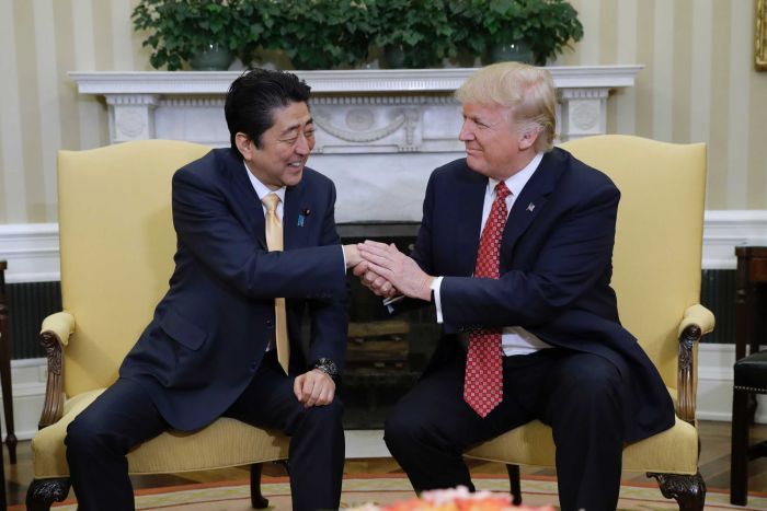 PHOTO: Japanese Prime Minister Shinzo Abe (L) has met with US President Donald Trump in Washington. (AP: Evan Vucci)