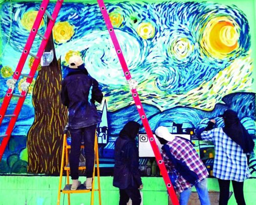 Young Girls Embellish Zahedan by Painting Masterpieces on Walls