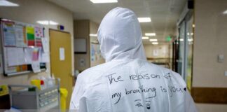 Iranian Medical Staff Wearing Masks Speak via Poems on their Suits 2