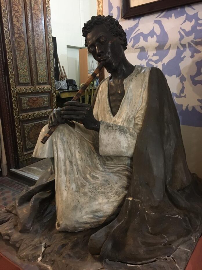 Black Flute Player: Magnificent Sculpture by Master Sadighi