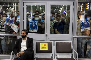 Iranian wrestlers receive hero's welcome at home