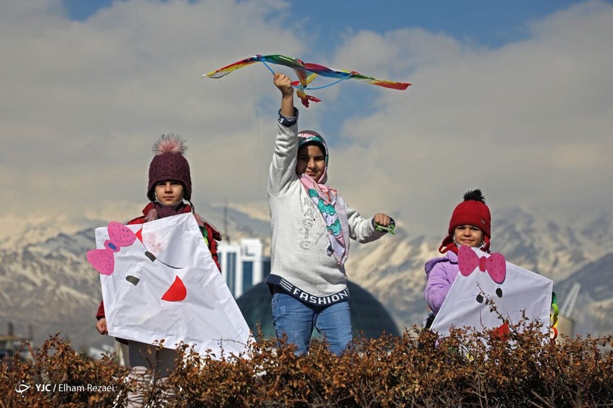 Iranian and Afghan children take part in the Kite Runner Festival in Tehran
