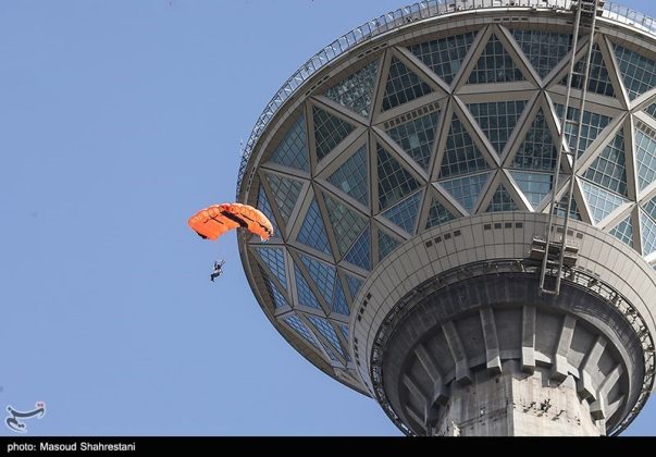 Parachutists jump off Tehran's Milad Tower to mark Islamic Republic Day