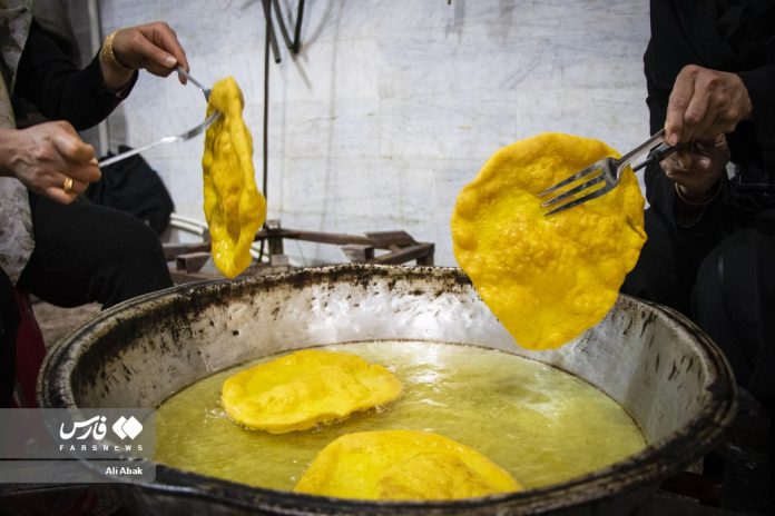 People in Iran make traditional cookies