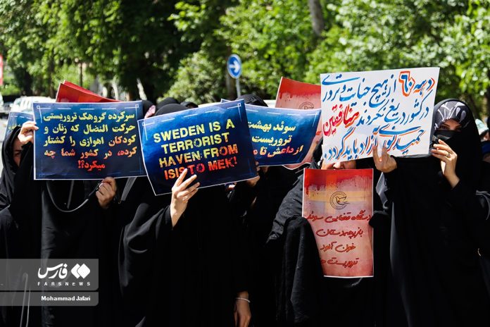 Iranians rally outside the Swedish embassy in Tehran