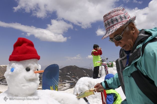 Summertime snowman festival in Tehran Tochal heights