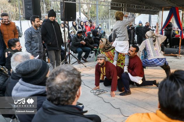 People watch street performances in Tehran on sideline of intl. theatre festival