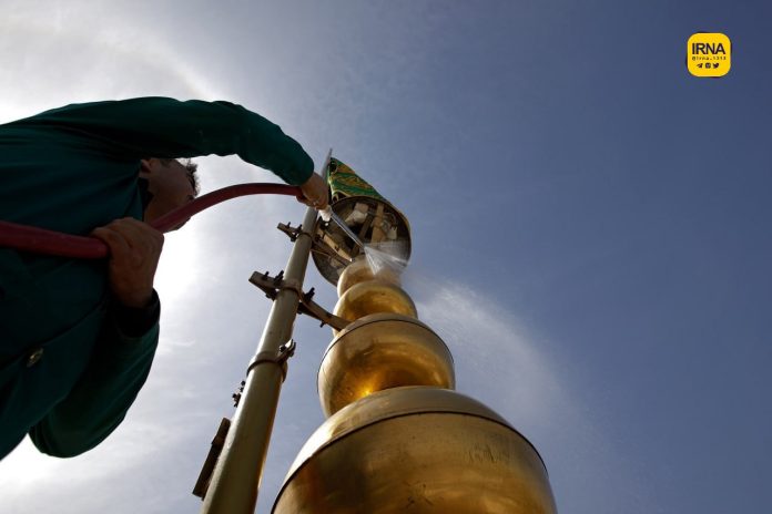Cleansing ritual performed at Imam Reza’s holy shrine in Iran’s Mashhad