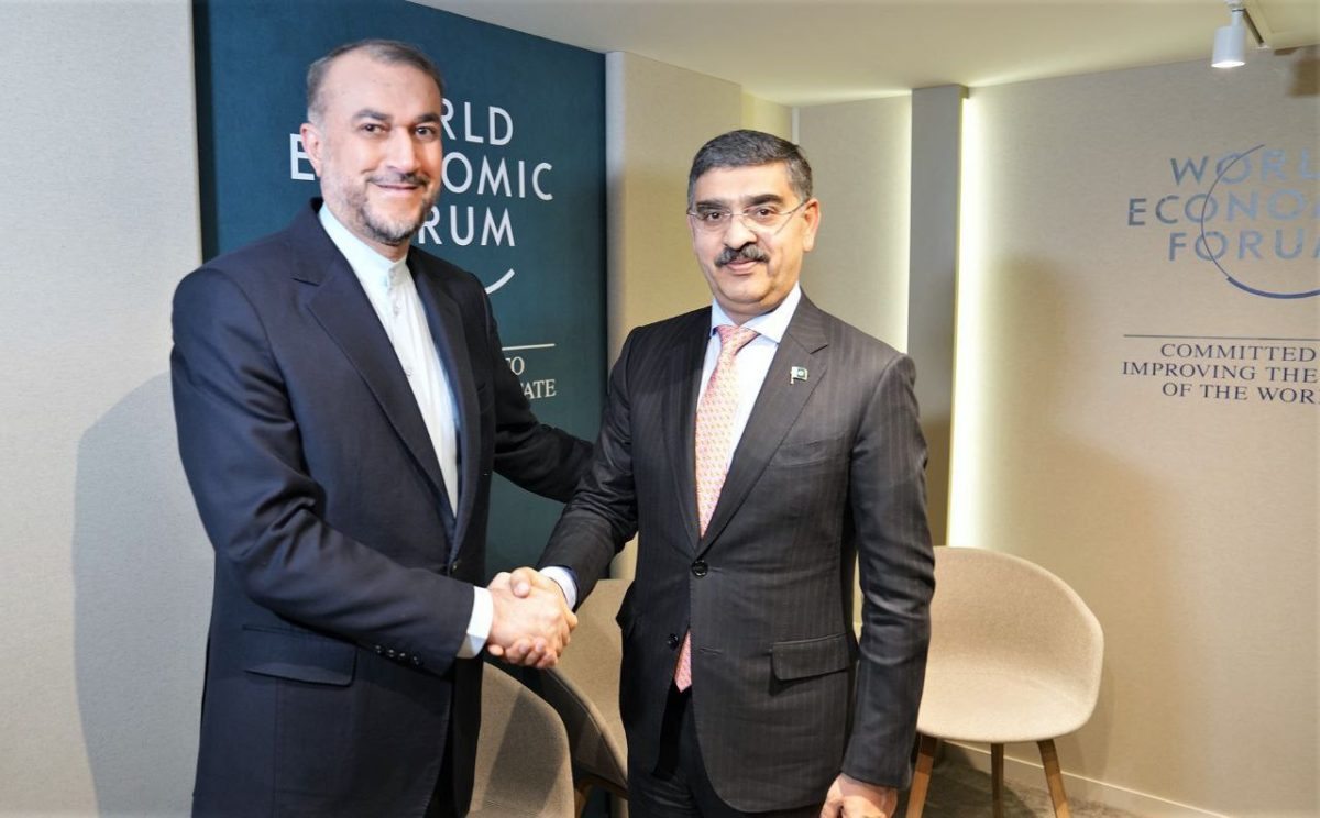 Pakistan's Caretaker Prime Minister Anwar ul Haq and Iranian Foreign Minister Hossein Amirabdollahian