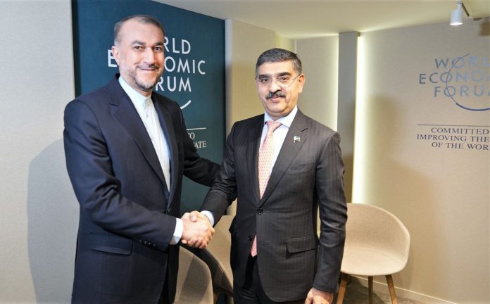 Pakistan's Caretaker Prime Minister Anwar ul Haq and Iranian Foreign Minister Hossein Amirabdollahian