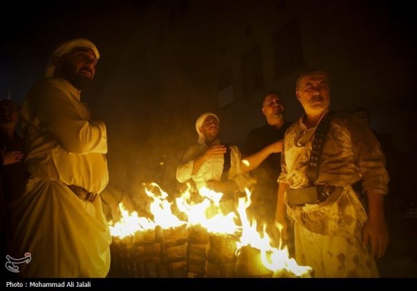 Najafis in Iran’s Qom mourn Imam Hussein’s martyrdom by torch-carrying rituals