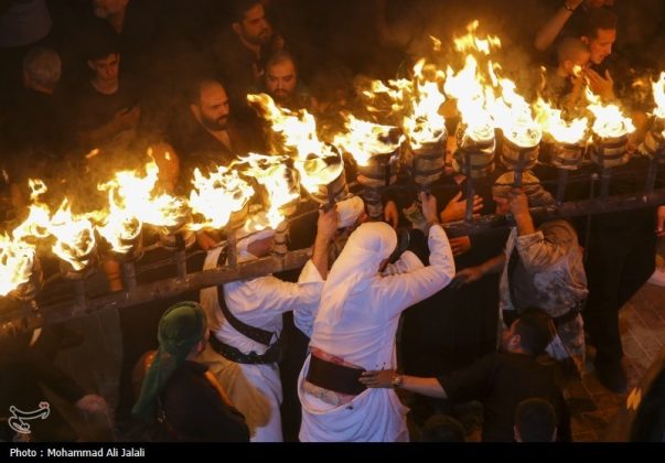 Najafis in Iran’s Qom mourn Imam Hussein’s martyrdom by torch-carrying rituals