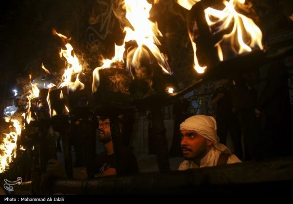 Najafis in Iran’s Qom mourn Imam Hussein’s martyrdom by torch-carrying rituals