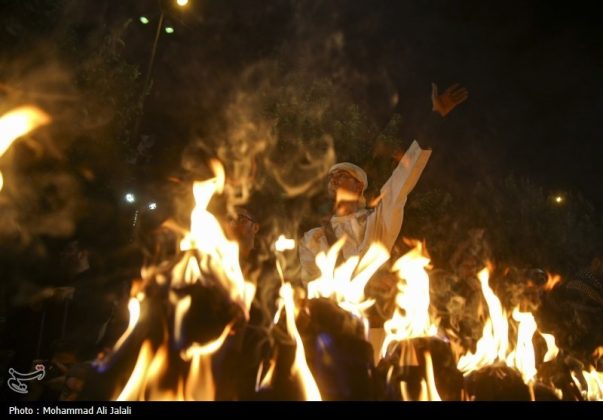 Najafis in Iran’s Qom mourn Imam Hussein’s martyrdom by torch-carrying rituals