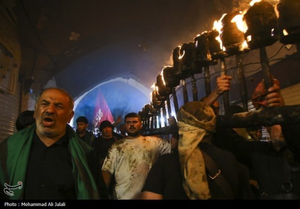 Najafis in Iran’s Qom mourn Imam Hussein’s martyrdom by torch-carrying rituals