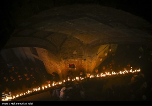 Najafis in Iran’s Qom mourn Imam Hussein’s martyrdom by torch-carrying rituals