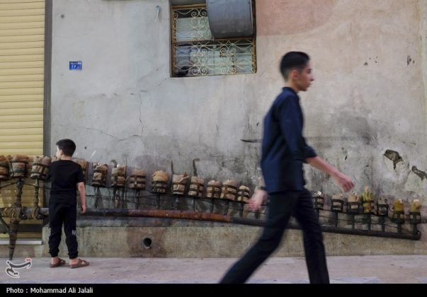 Najafis in Iran’s Qom mourn Imam Hussein’s martyrdom by torch-carrying rituals